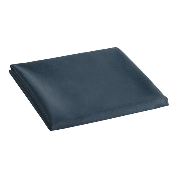 A folded navy blue cloth table cover.