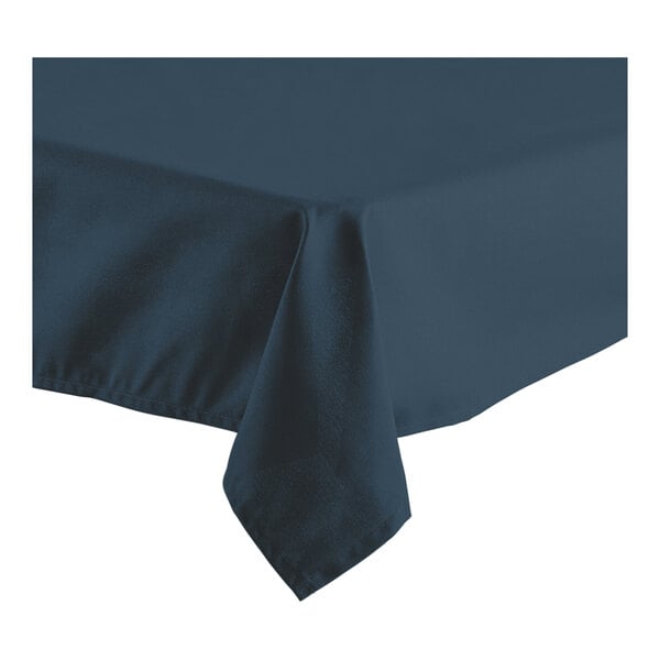 A close-up of a navy blue Oxford cloth table cover with a folded edge.