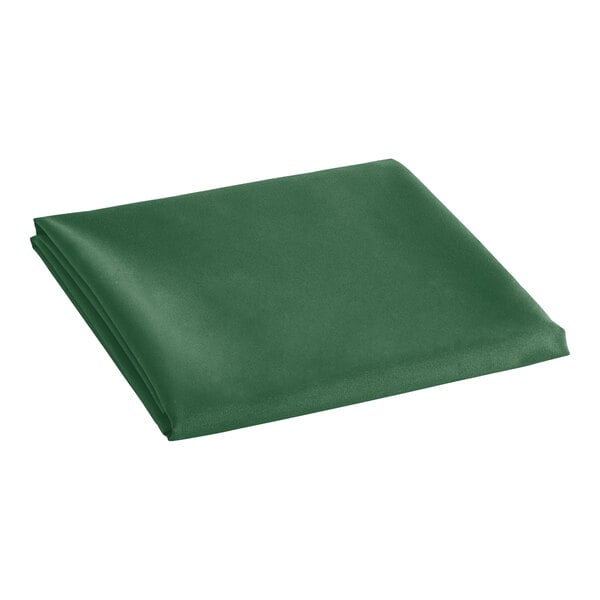 A folded hunter green Oxford cloth table cover on a white background.