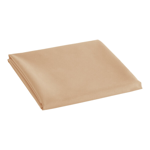 A folded beige Oxford cloth table cover.