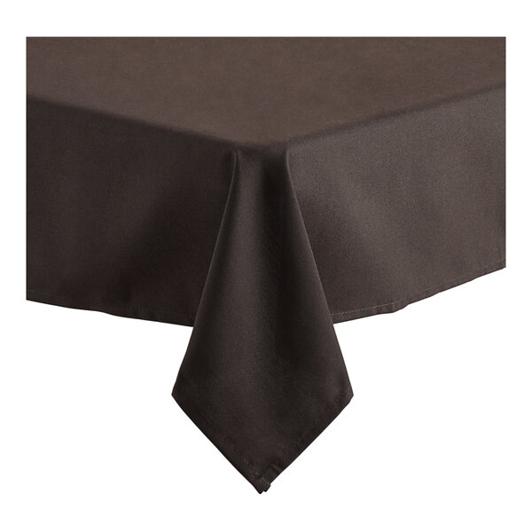 A chocolate brown square tablecloth with a folded edge on a table.