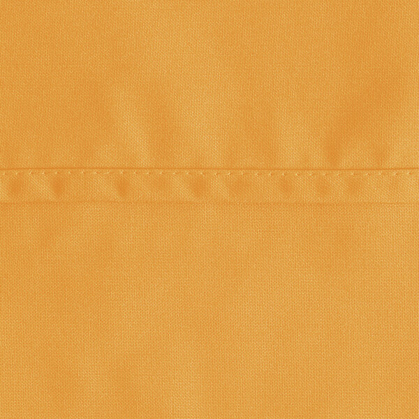 A close-up of a gold fabric with a white background.