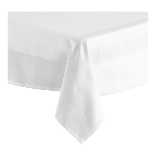 A white square tablecloth with a hemmed edge and a satin band.