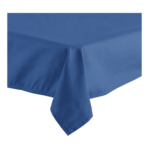 A close-up of a folded edge on a royal blue Oxford tablecloth.