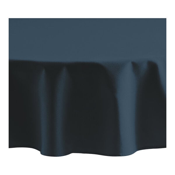 A navy blue Oxford round tablecloth with a hemmed edge.