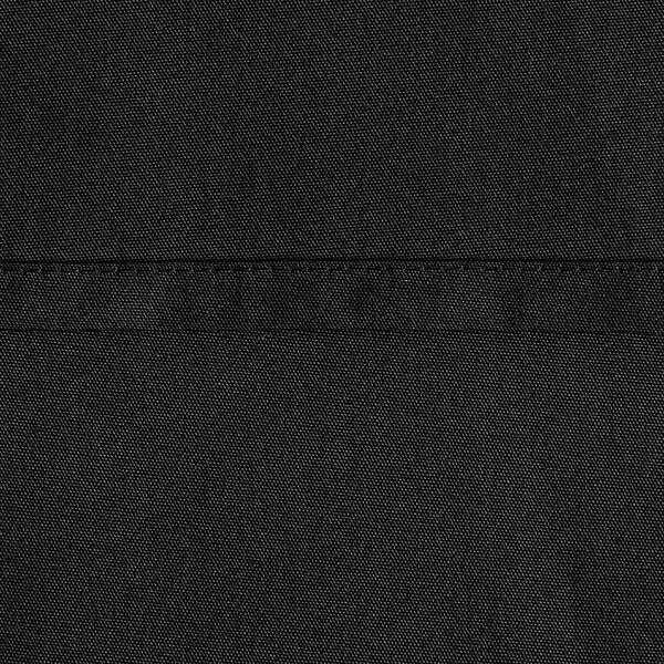 A close-up of a black rectangular Oxford table cover.