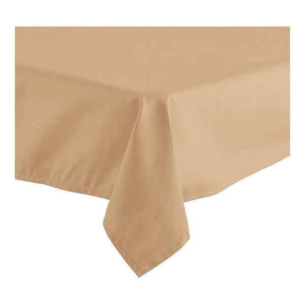 A close-up of a sandalwood Oxford hemmed cloth table cover on a table with a corner showing.