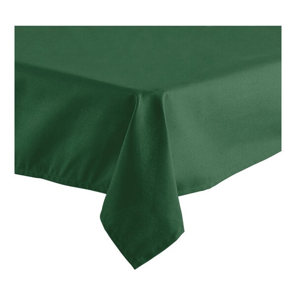 A hunter green hemmed Oxford square tablecloth on a table.