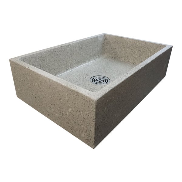 A rectangular stone Stern-Williams terrazzo mop sink basin with a drain.