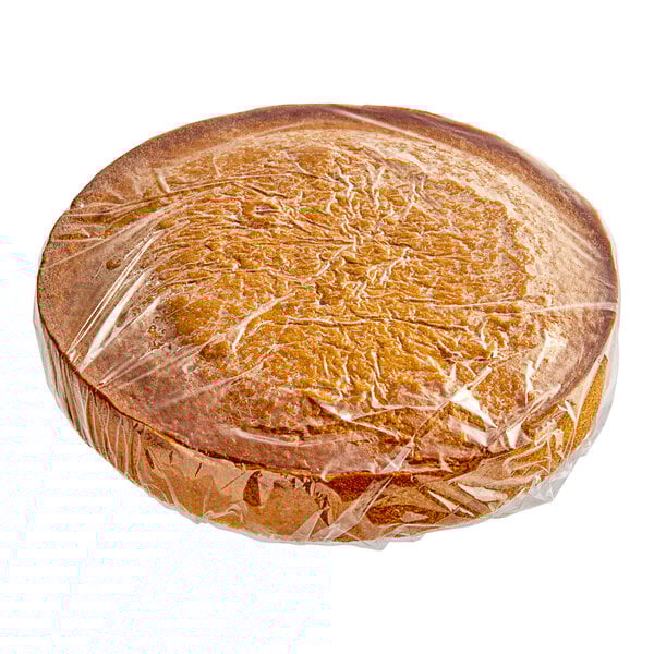A Rich's Allen un-iced round yellow cake wrapped in plastic.
