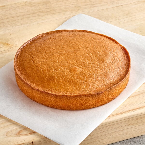 A Rich's Allen round yellow cake on a white surface.