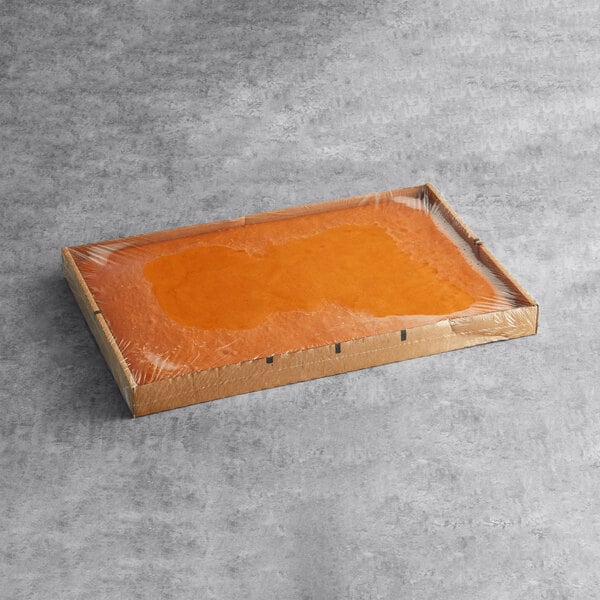 A rectangular box with a white liquid inside.