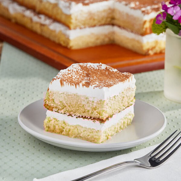 A piece of Rich's vanilla pre-soaked sponge cake on a plate.