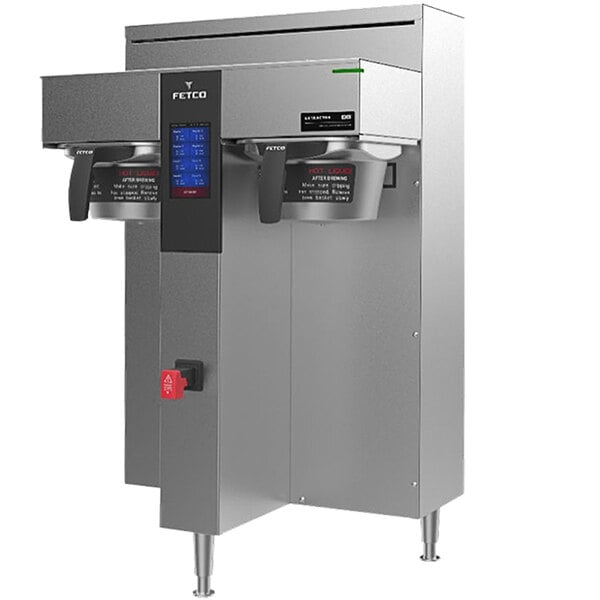 A stainless steel Fetco commercial coffee machine with a screen and buttons.