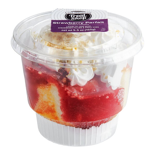 A plastic container with Our Specialty Treat Shop Strawberry Parfait inside.