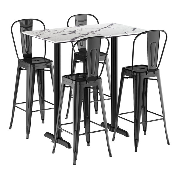 A Lancaster Table & Seating rectangular white marble table with black barstools around it.
