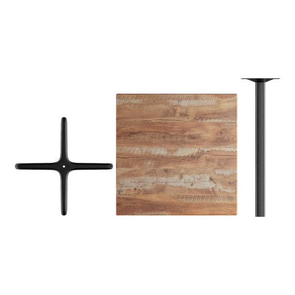 A Lancaster Table & Seating square bar height table with a Yukon Oak top and black metal base.