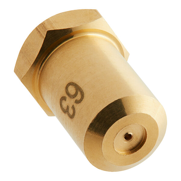 A gold metal cylinder with the number 63 carved in it.