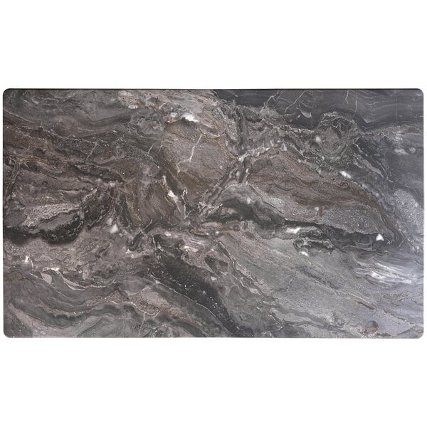 A Lancaster Table & Seating rectangular stone table with black and white designs.