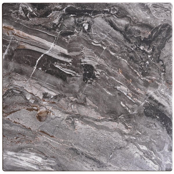 A Lancaster Table & Seating Paladina bar height table with a black marble top.