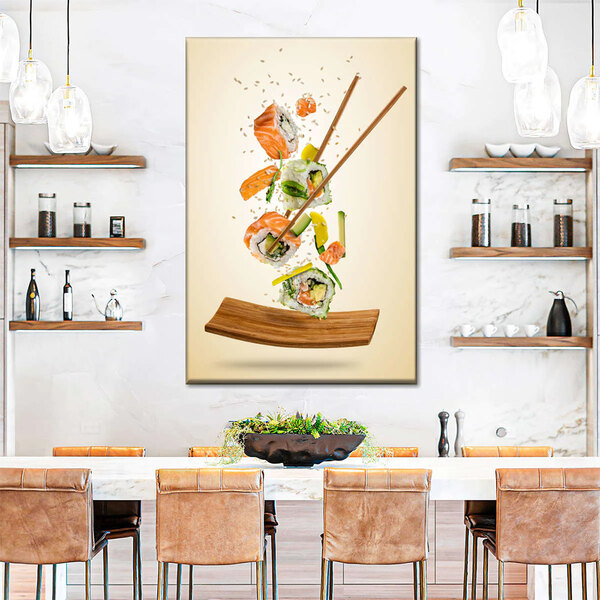 A large canvas of salmon sushi rolls with chopsticks on a table.