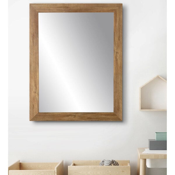 A BrandtWorks wooden mirror with a blonde barn wall finish on a white wall.