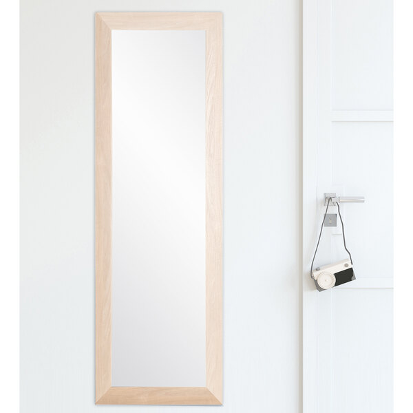 A BrandtWorks natural grain finish mirror on a white wall.