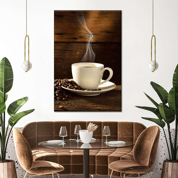 A canvas wall art print of a coffee cup on a table with coffee beans and steam.
