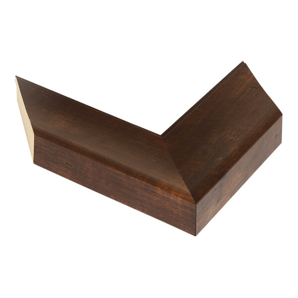 The wooden corner of a BrandtWorks mocha walnut mirror.