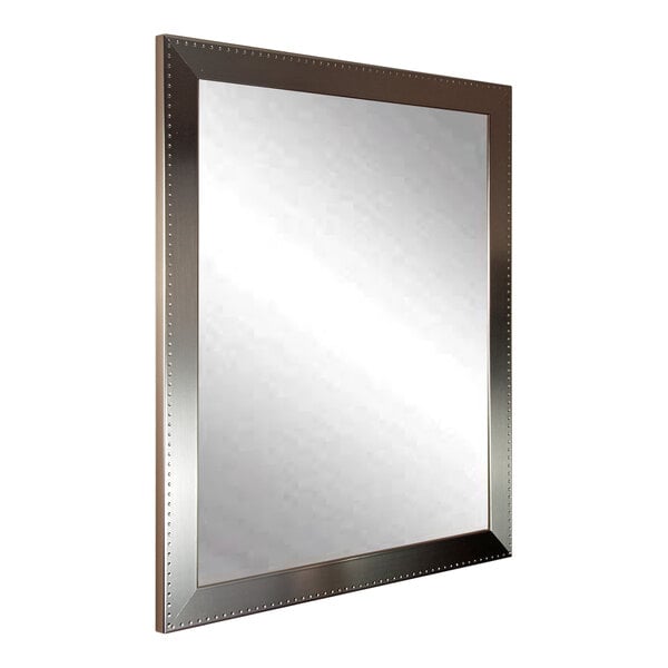 A BrandtWorks mirror with a silver frame.