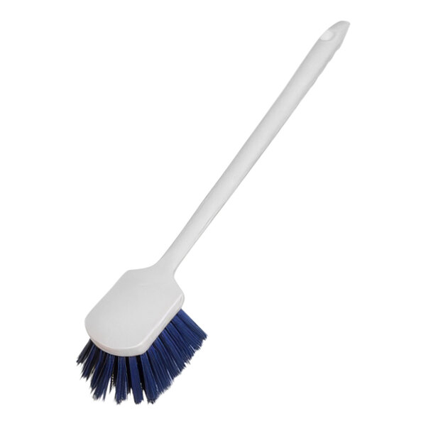 A white brush with a blue handle and blue bristles.