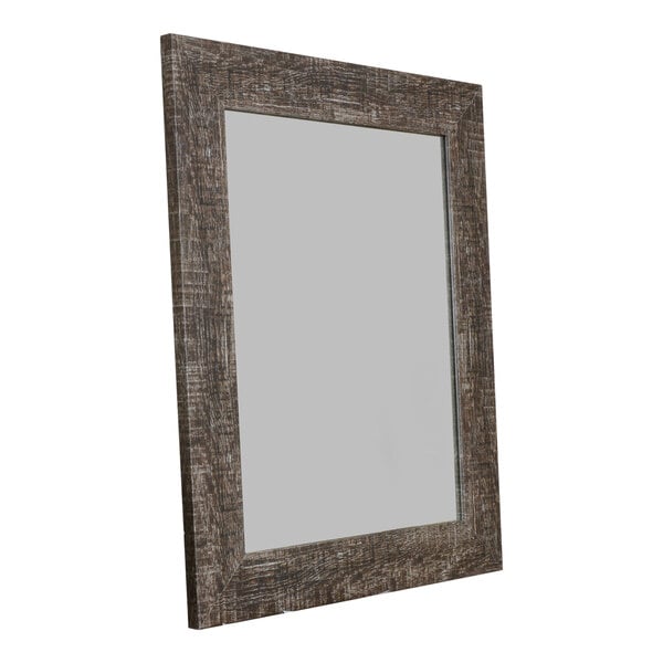 A BrandtWorks wooden mirror with a distressed dark brown frame.
