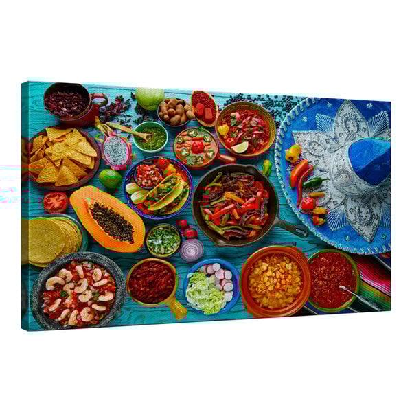 A colorful Mexican food spread on a table with blue accents.