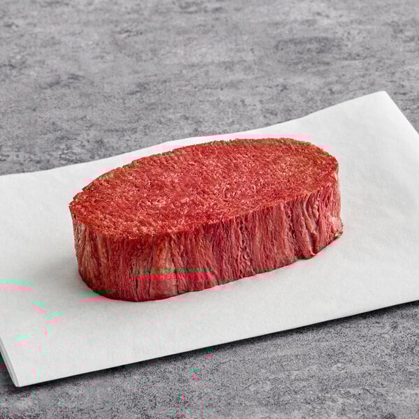 A large piece of Chunk Foods plant-based vegan steak on a white plate.