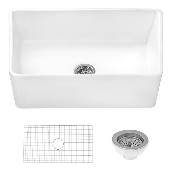 A white Ruvati fireclay sink with a drain and a grid.