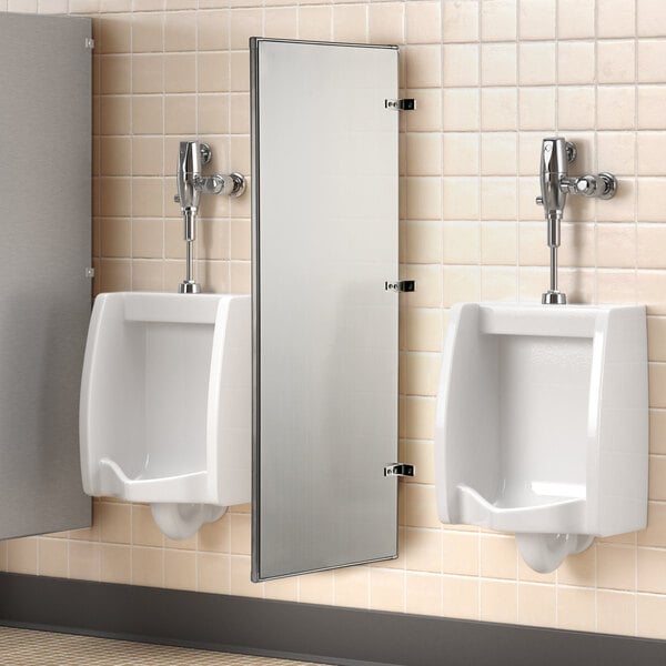 A stainless steel Lavex urinal partition on a white tiled wall.