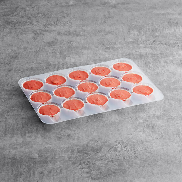 A tray of Brill pre-portioned strawberry muffin batter on a gray surface.