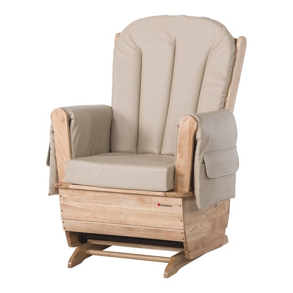 A Foundations wooden glider rocker with tan cushions.