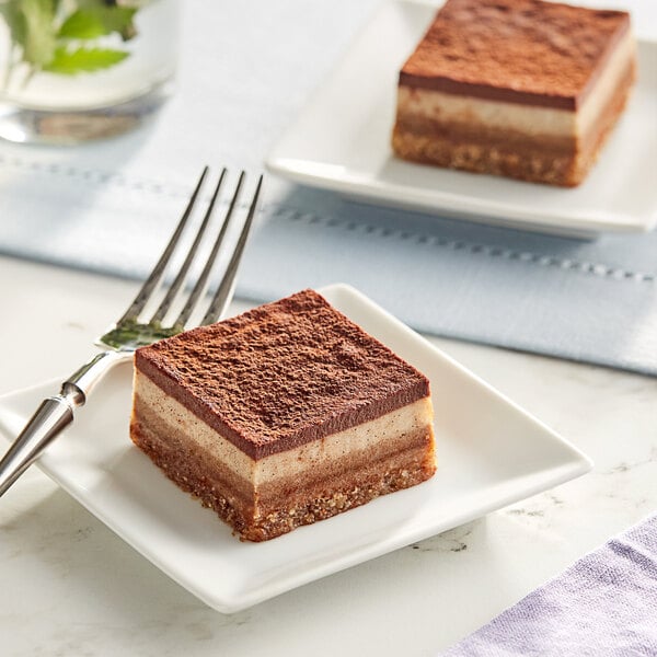 Two Nats Rawline plant-based vegan tiramisu raw cake squares on a plate.