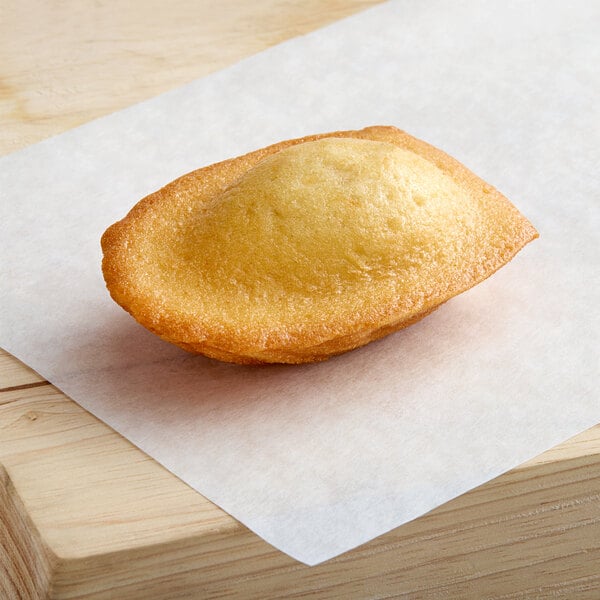 A St. Michel strawberry-filled madeleine on a piece of paper.