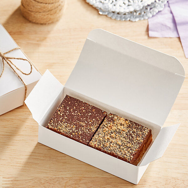 A white box of Nats Rawline chocolate caramel cake squares.