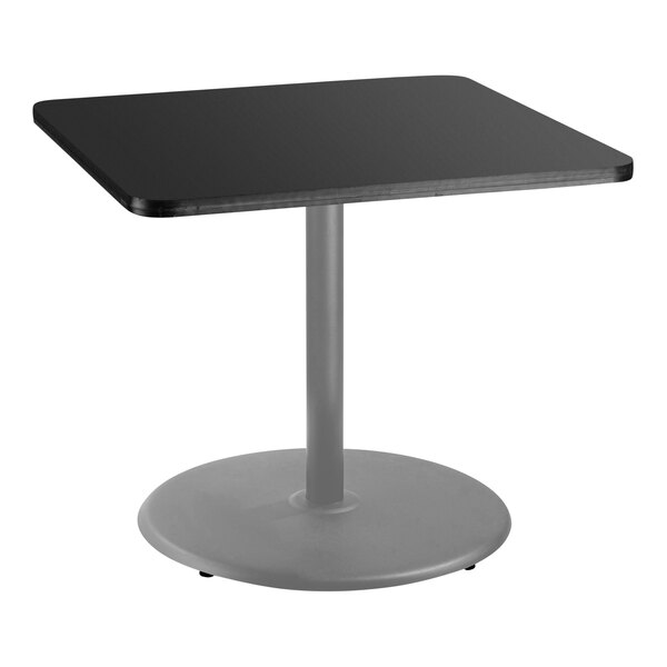 A black square table with a metal base.