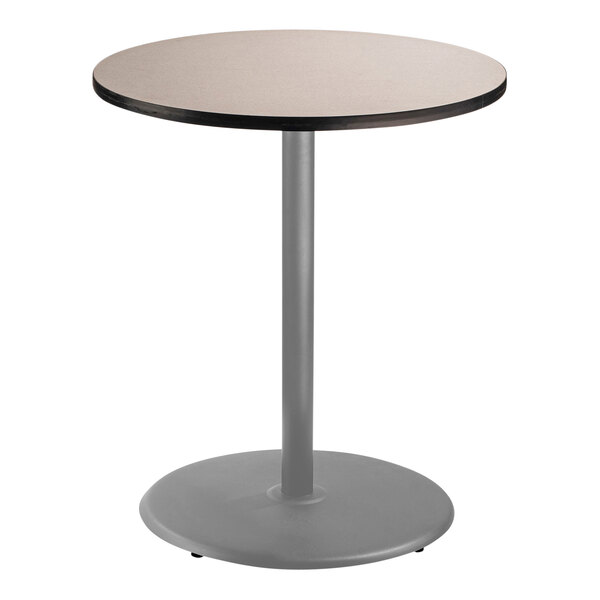 A National Public Seating round bar height table with a gray top and metal base.