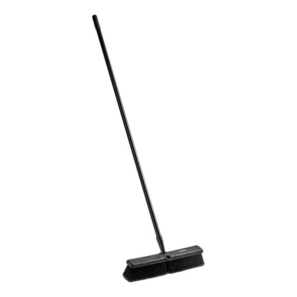A Lavex push broom with a long metal handle.