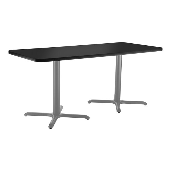A black rectangular National Public Seating cafe table with silver legs.