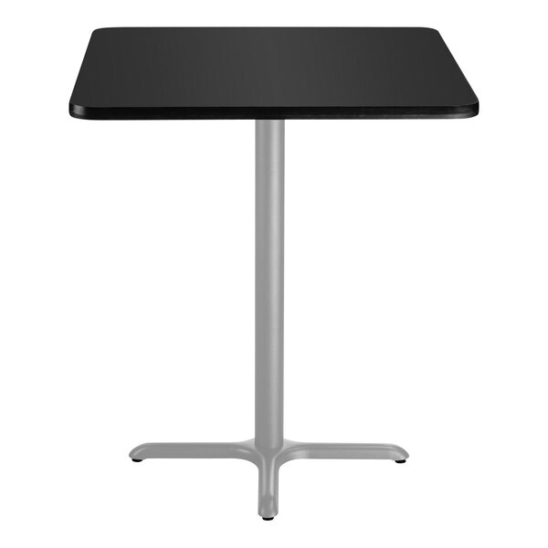 A black square National Public Seating cafe table with a silver X base.