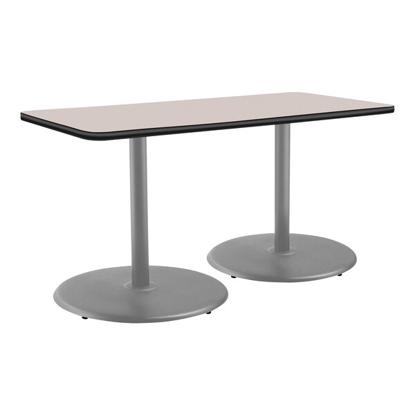 A National Public Seating gray rectangular cafe table with round, gray legs.