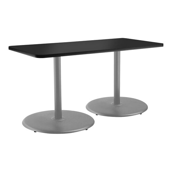 A black rectangular National Public Seating cafe table with a gray frame and round metal legs.