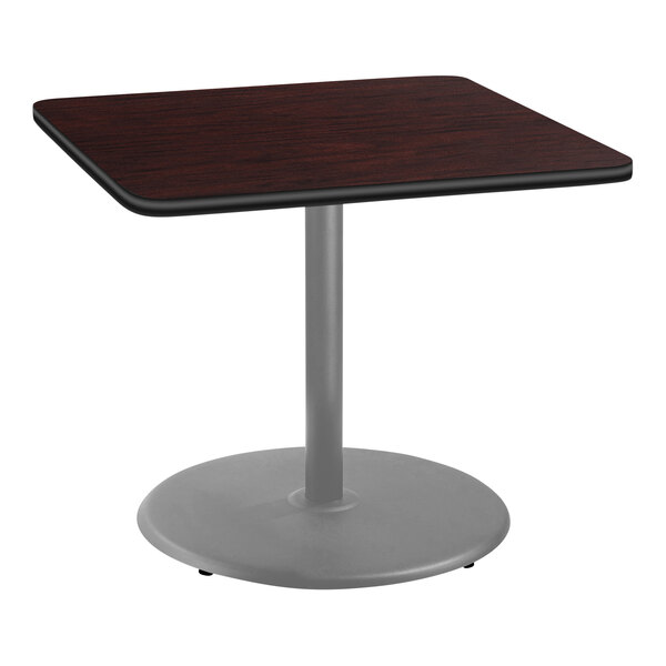 A National Public Seating square table with a mahogany top and gray metal base.