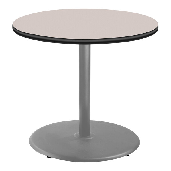 A National Public Seating round table with a gray top and metal base.